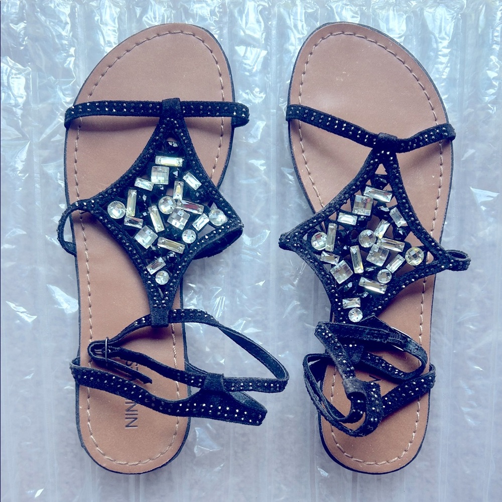 Nine West women’s summertime rhinestone embellished black sandals.